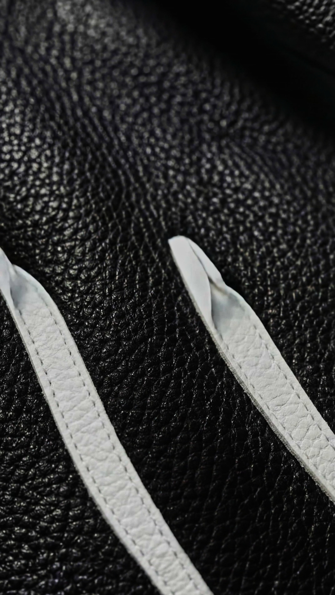 Macro white lines on black leather